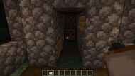 Paintings need to be placed on top of the signs to hide the entrance (Image via Minecraft)